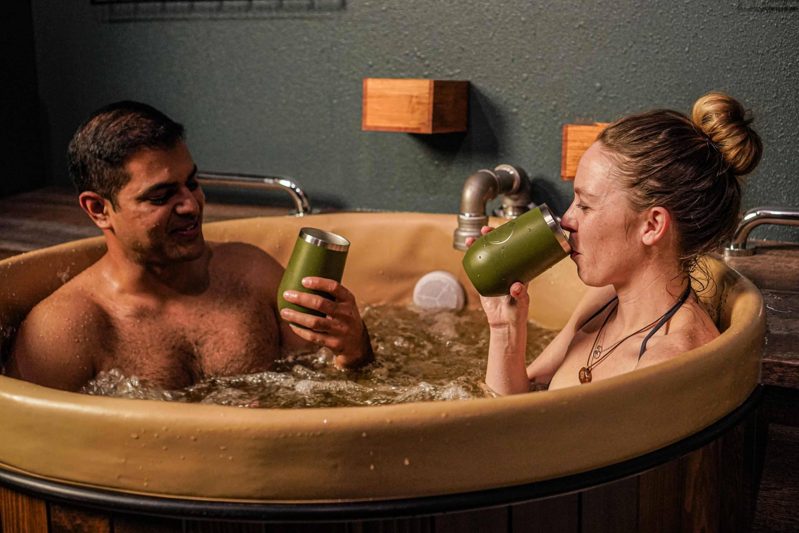 Couple enjoying a hop-infused beer bath at Oakwell Beer Spa in Denver